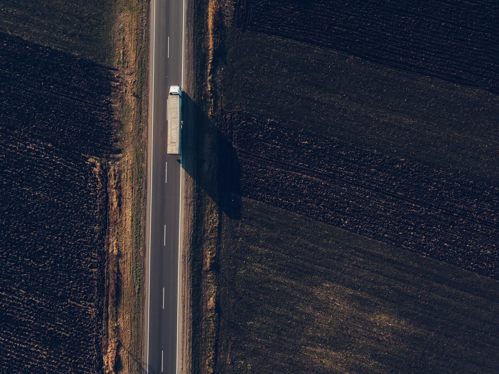 Aerial view of freight transportation truck on the road