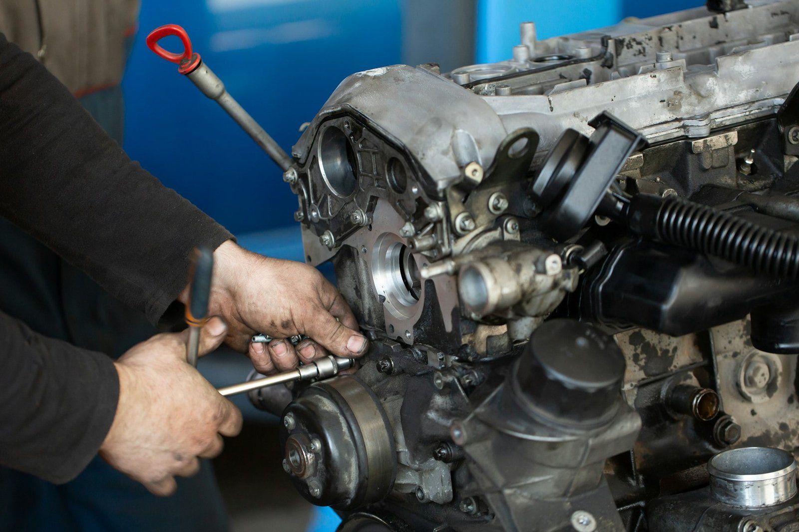 Auto mechanic checking an internal combustion engine