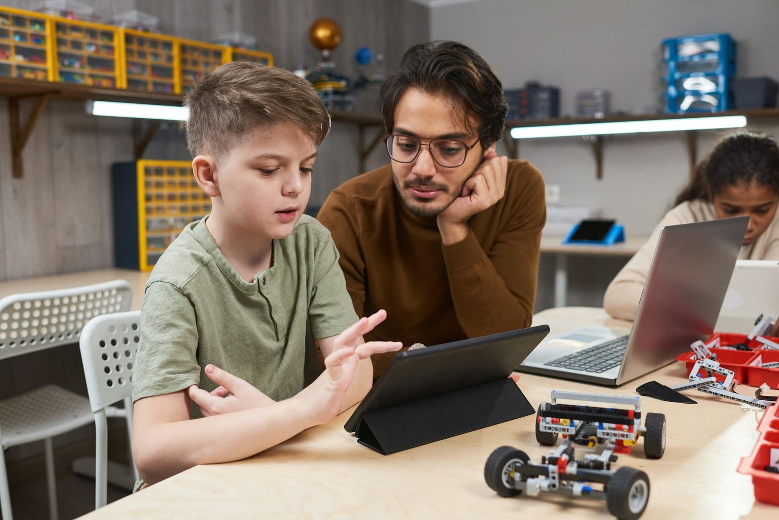 Boy controlling the robot from a tablet pc