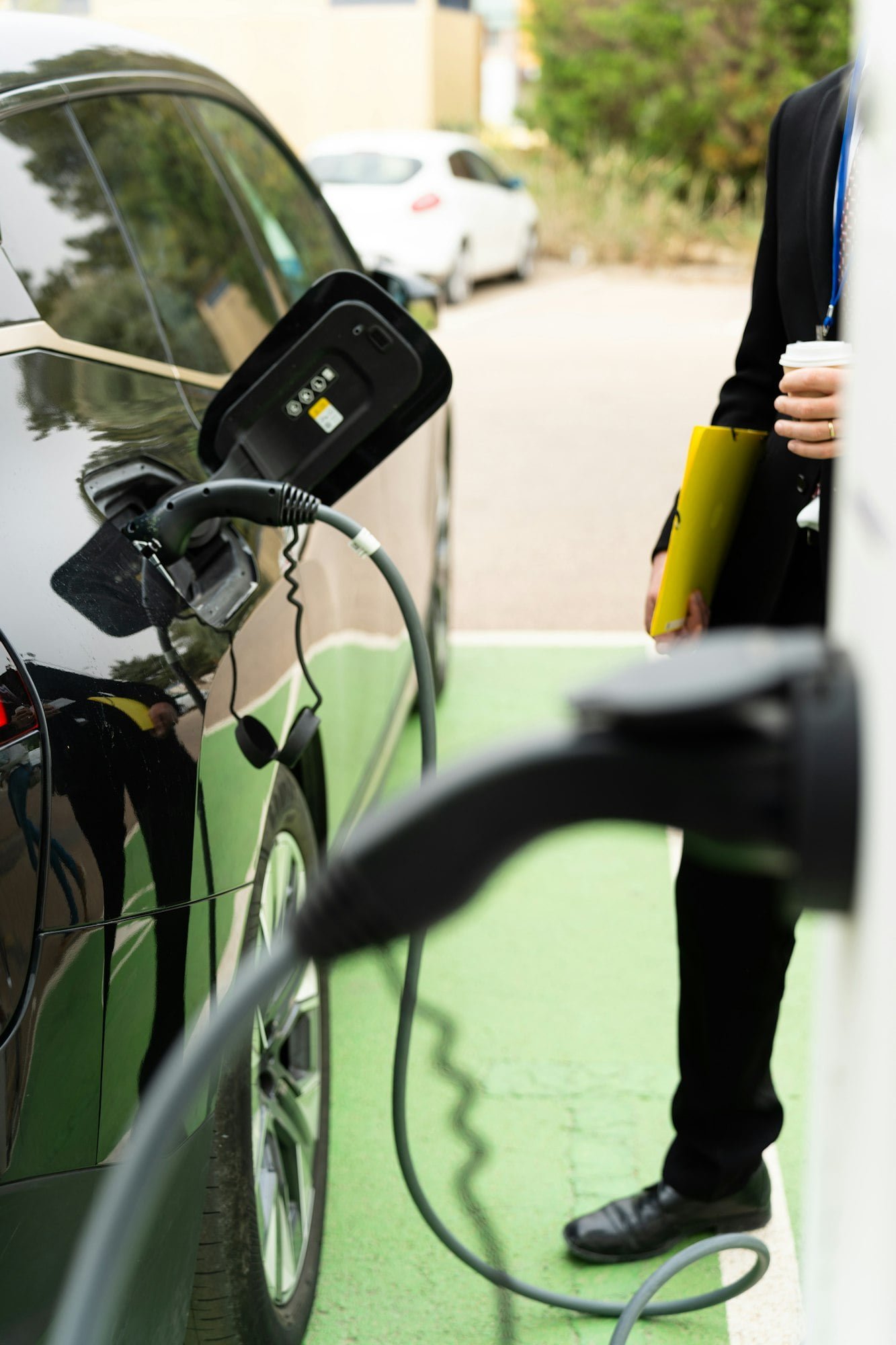 Electric car charging at a charging station.