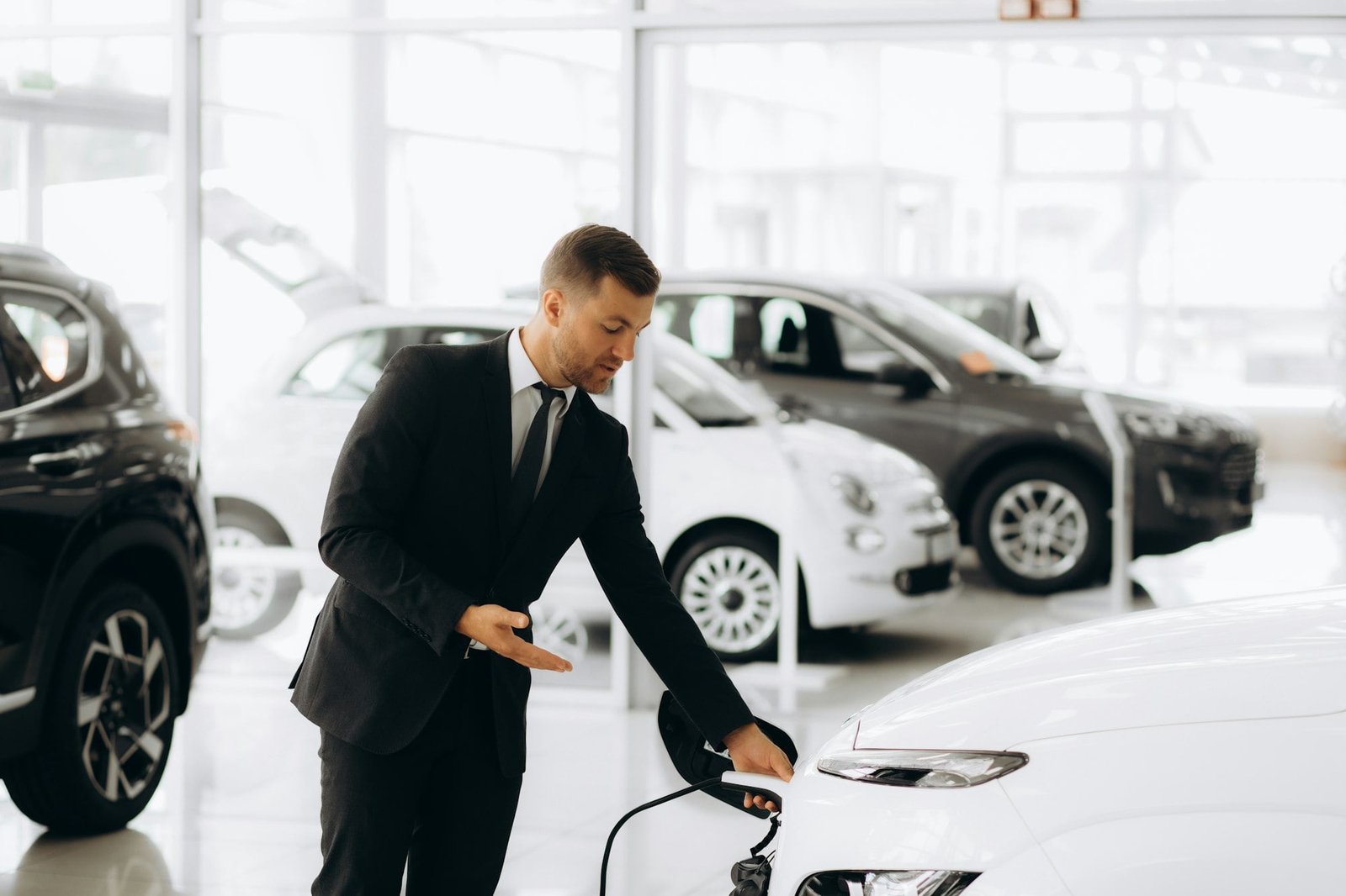 electric car sales manager at a car dealership