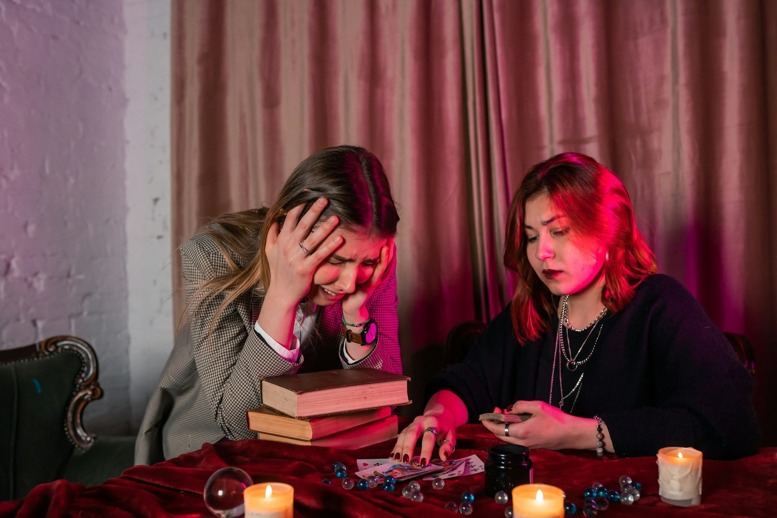 Fortune teller forecasting the future to woman with cards