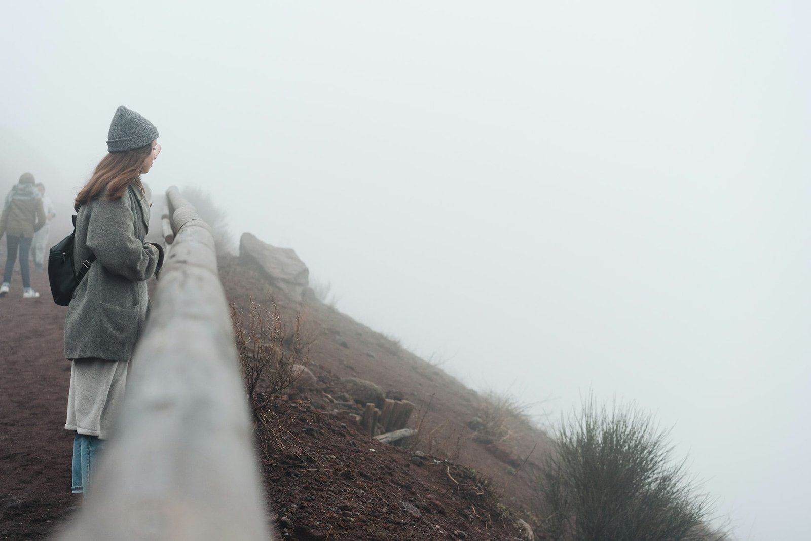 Girl climbs the path to the mountain