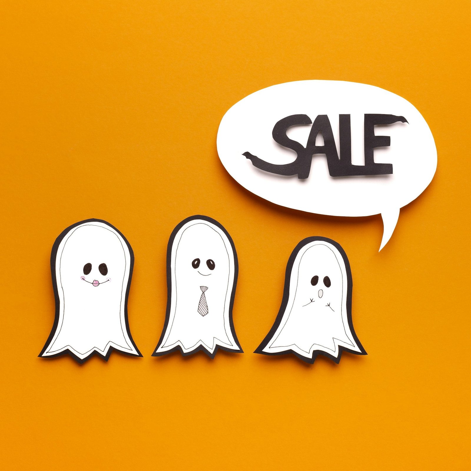 Happy ghosts predicting Halloween sales in speech bubble