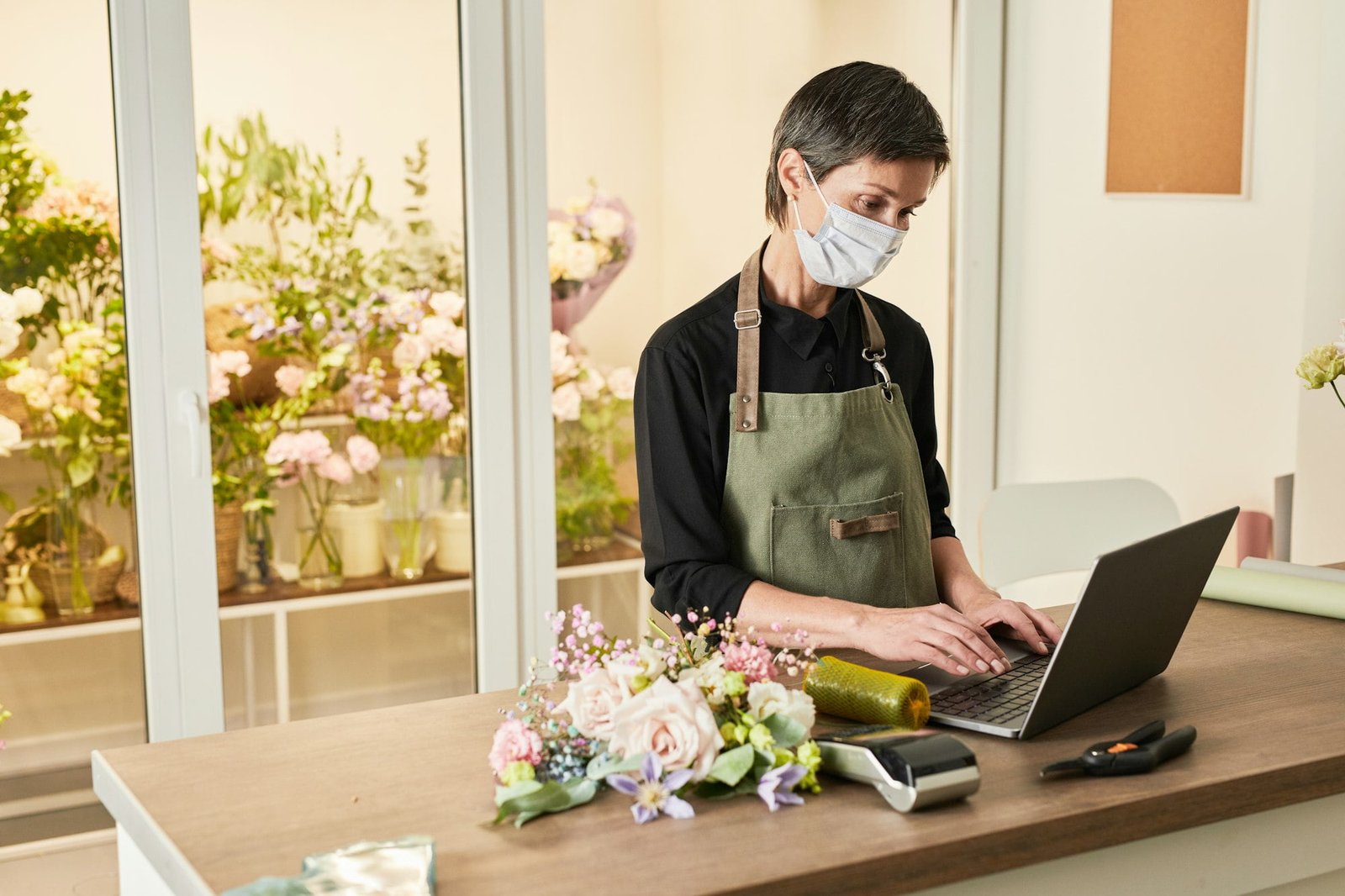 Sales Assistant Wearing Mask in Shop