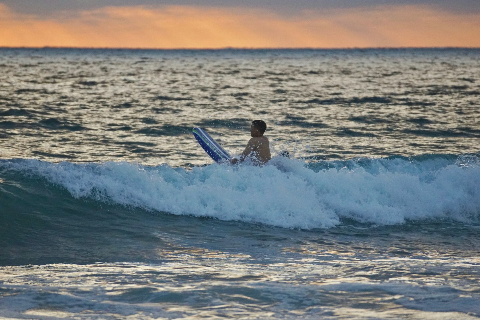 Surfer waiting for the next wave