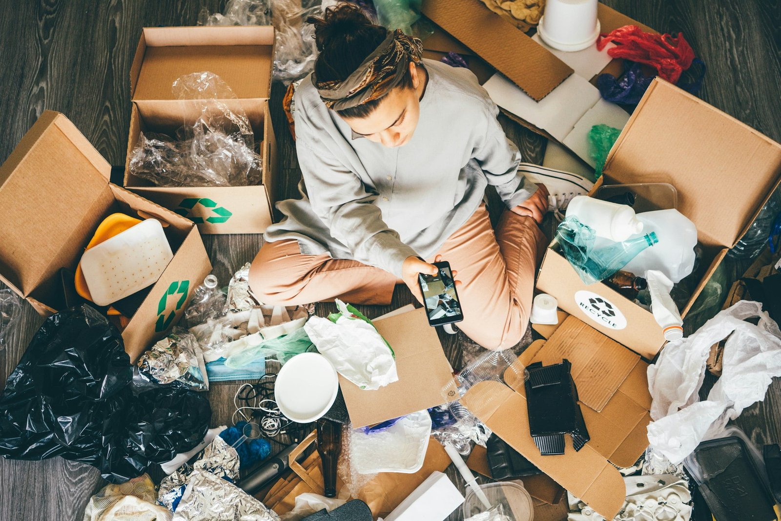 Woman sorting different waste.