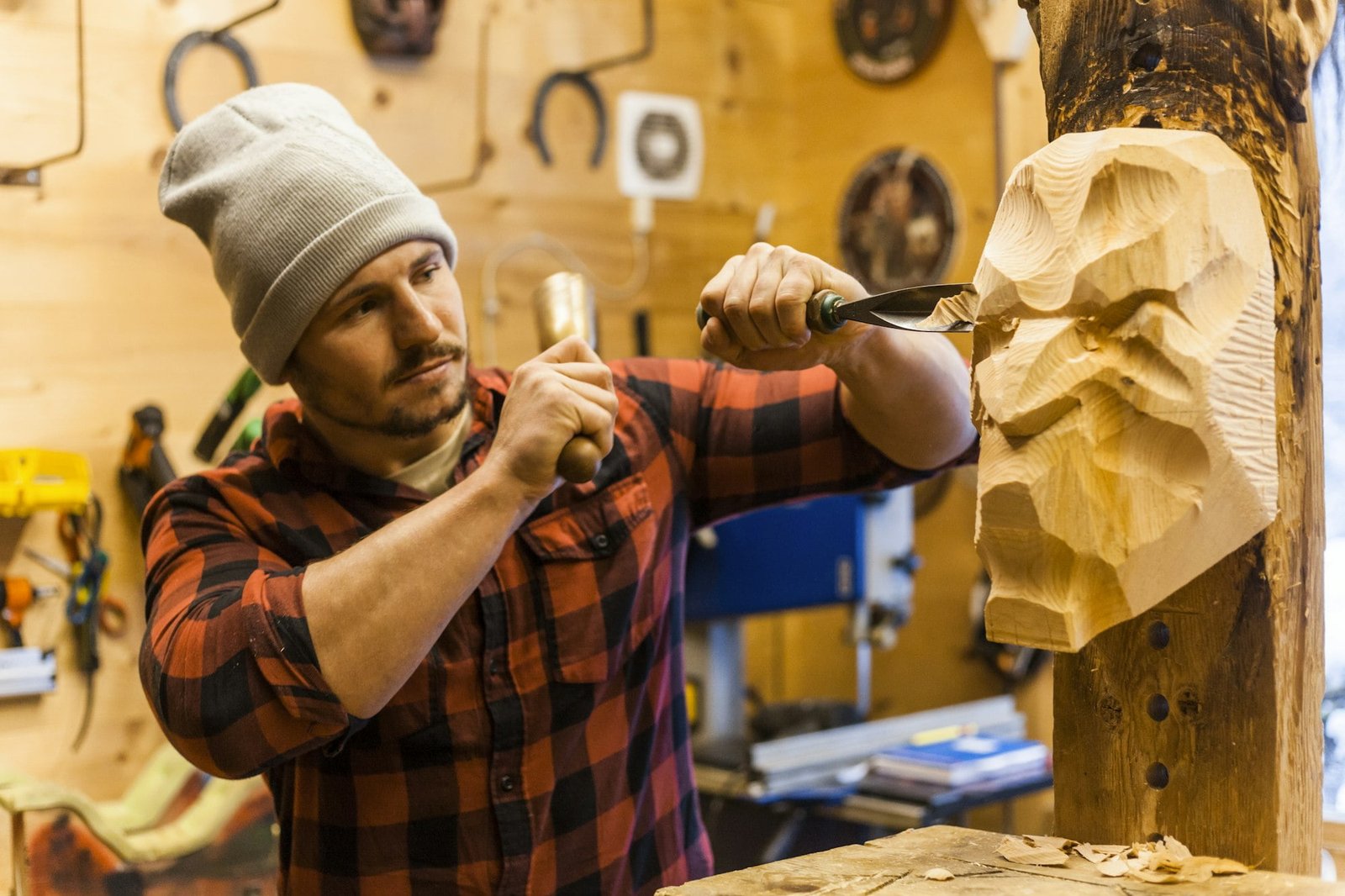 Wood carver manufacturing traditional Krampus mask